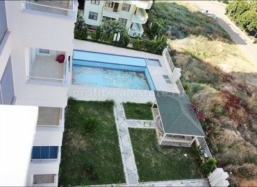 Меблированные двухкомнатные апартаменты, в 350 метрах от моря, Махмутлар, Аланья ID-4981 фото-15