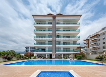 Three-bedroom duplex, with furniture and appliances, in a well-kept residential complex with excellent facilities, just 200 meters from the Kestel beach, Alanya ID-5284 фото-1