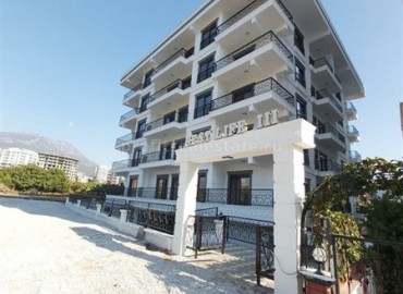 One-bedroom apartment, in fine finish, in a residential complex built in 2020, in the center of Mahmutlar ID-5298 фото-1}}