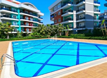 Spacious one-bedroom apartment in a well-kept residential complex in Oba, Alanya, 70 m2 ID-5448 фото-1