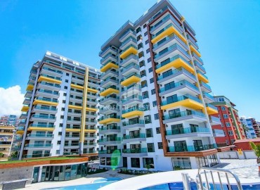 New one-bedroom apartment, in a residential complex with rich infrastructure, on the first line of the Mahmutlar, Alanya, 55 m2 ID-5481 фото-1