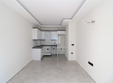 Новая двухкомнатная квартира, в чистовой отделке, в 300 метрах от центра Махмутлара, Аланья, 55 м2 ID-5755 фото-5
