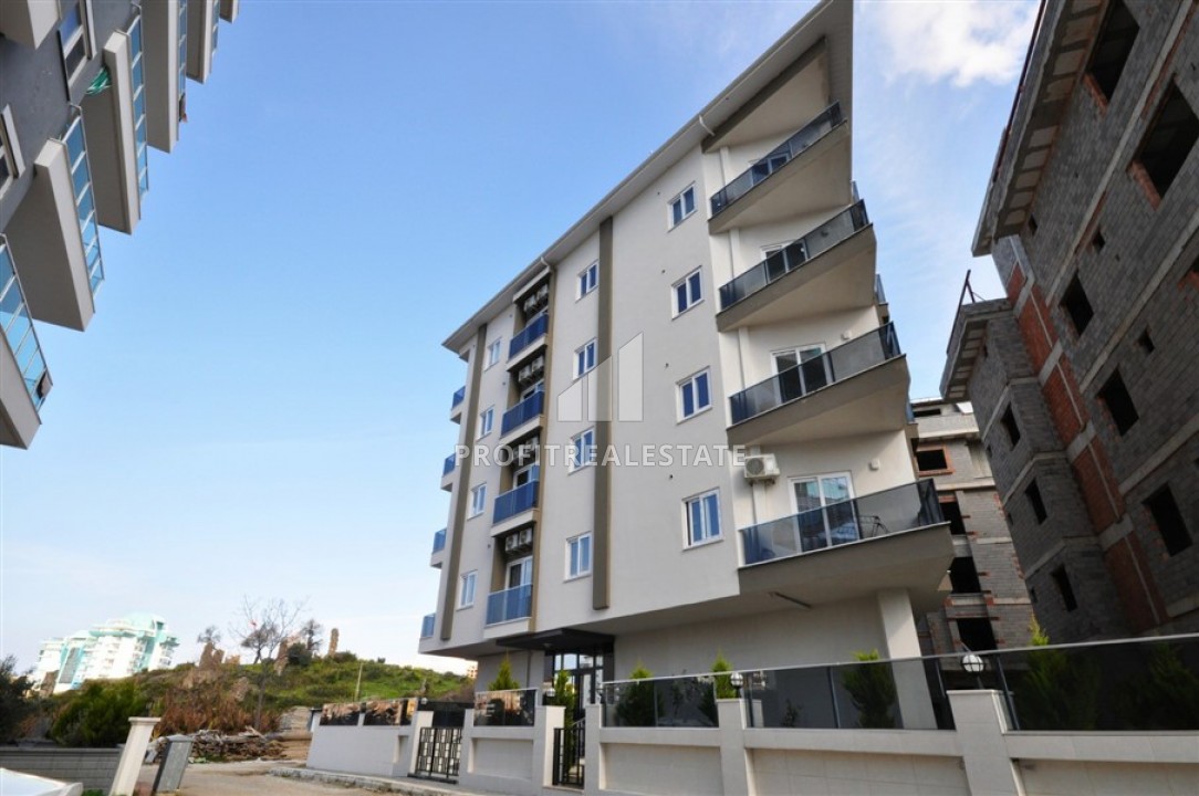 New furnished apartment, 1 + 1 layout with an area of 50m2 in Mahmutlar, Tuesday market area ID-5028 фото-1