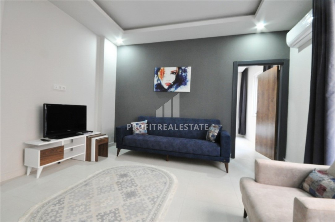 New furnished apartment, 1 + 1 layout with an area of 50m2 in Mahmutlar, Tuesday market area ID-5028 фото-2