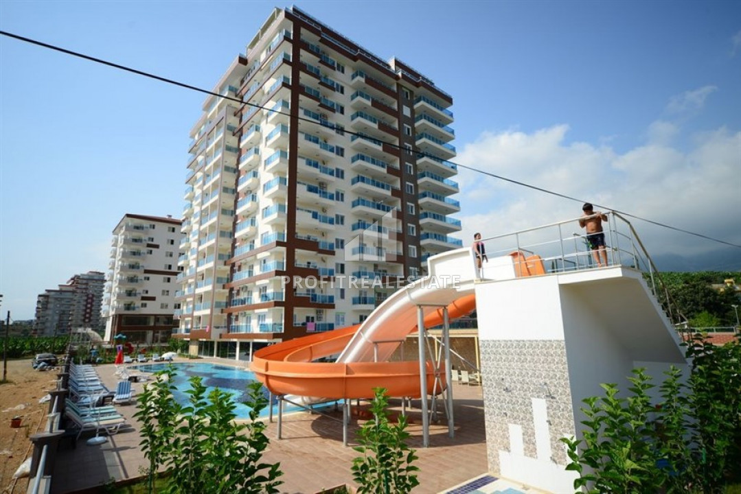 Отличное сочетание цены и качества: меблированная двухкомнатная квартира недалеко от моря в Махмутларе ID-6126 фото-1
