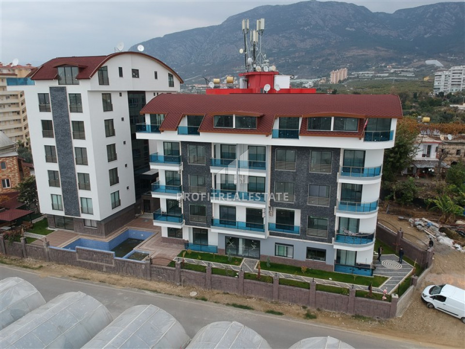 Новый проект от застройщика в Алании: квартиры разных планировок в 1500 м от моря, у подножия гор ID-6159 фото-1