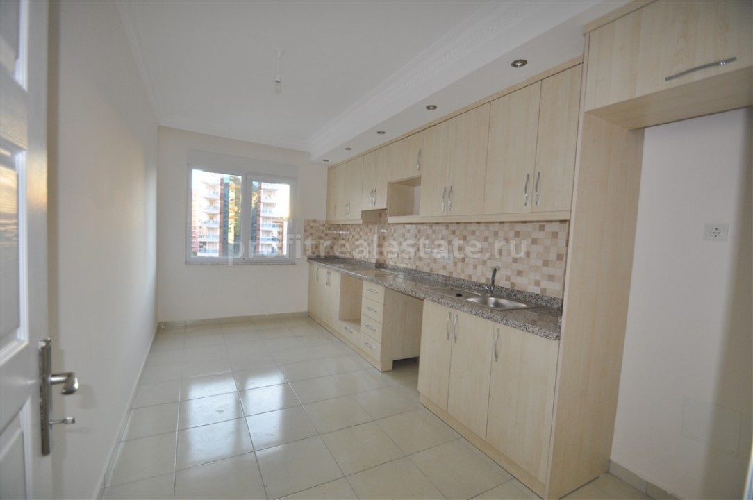 Apartment with separate kitchen in the area of Mahmutlar, Alanya, Turkey ID-0401 фото-1
