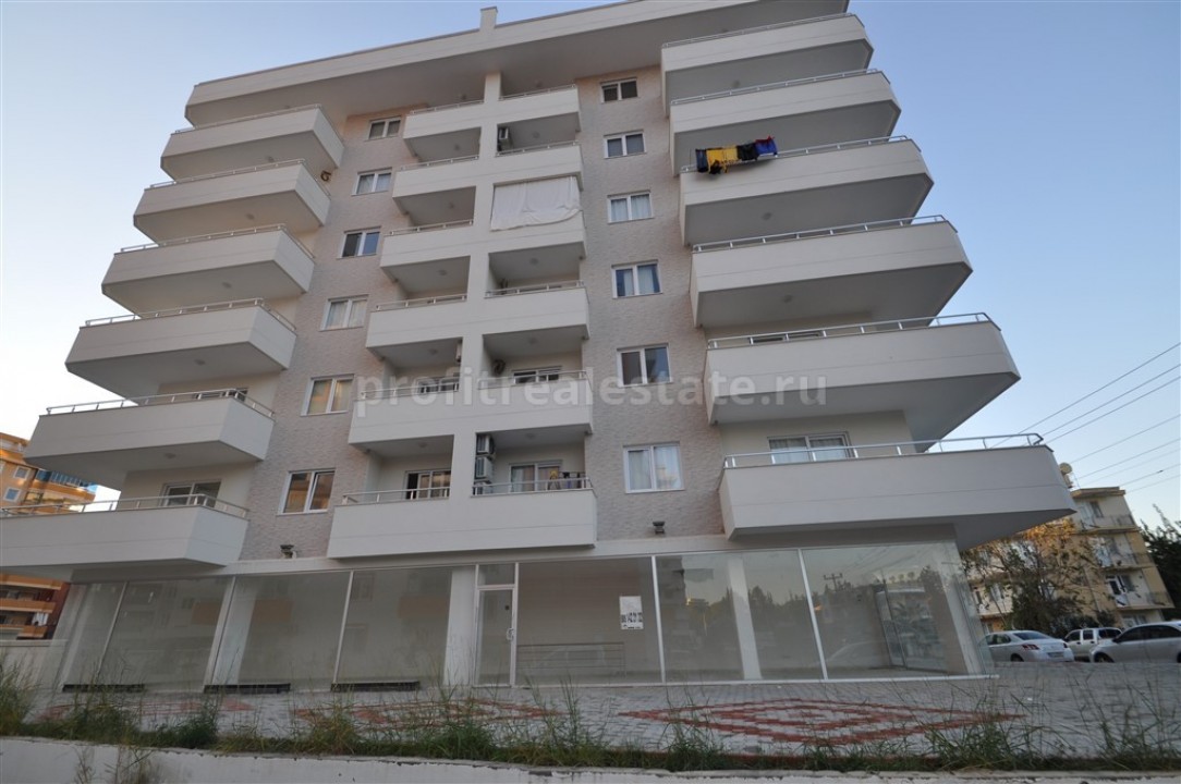 Apartment with separate kitchen in the area of Mahmutlar, Alanya, Turkey ID-0401 фото-2