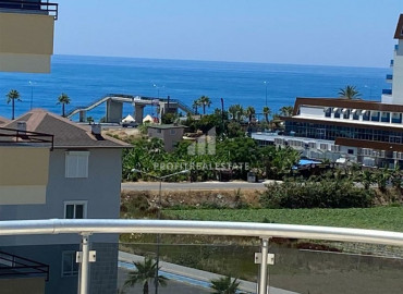 Spacious duplex 3 + 1 with sea views in a house with a swimming pool in Mahmutlar at a bargain price ID-6210 фото-1