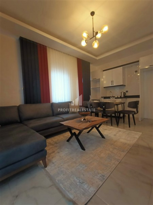 Furnished 1 + 1 apartment in a new residence with complete facilities in Mahmutlar ID-6254 фото-1