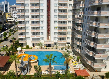 Apartment 2 + 1 overlooking the sea and the Alanya fortress in a residence with good facilities in Mahmutlar ID-6327 фото-2}}