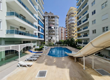 Обустроенная двухкомнатная квартира на высоком этаже, 70м² в центре Махмутлара в 350 м от моря ID-6328 фото-24