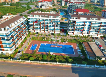 Well-groomed apartment 2 + 1 in a residence with excellent infrastructure 200 m from the sea in the Alanya - Kestel area ID-6344 фото-1}}