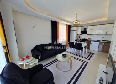 Большая меблированная квартира с одной спальней, площадью 75 м² в 150 м от моря в Махмутларе ID-6381 фото-1