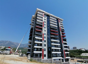 Two bedroom apartment with a separate kitchen in a new building with wide facilities in Mahmutlar ID-6404 фото-1