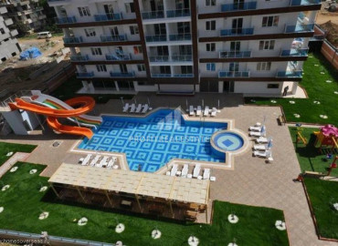 1 + 1 layout apartment in a residence with rich facilities near the sea in Mahmutlar ID-6474 фото-3