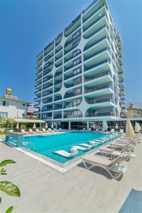 New 1 + 1 apartment with an area of 70m² in a residence with hotel facilities in Mahmutlar ID-6519 фото-1