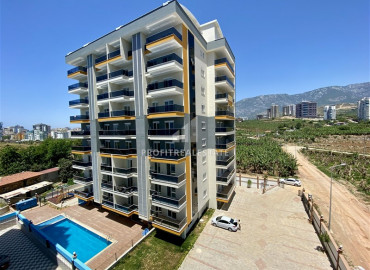 Ready to move in 1 + 1 apartment in a new residence in Mahmutlar at an excellent price ID-6535 фото-1
