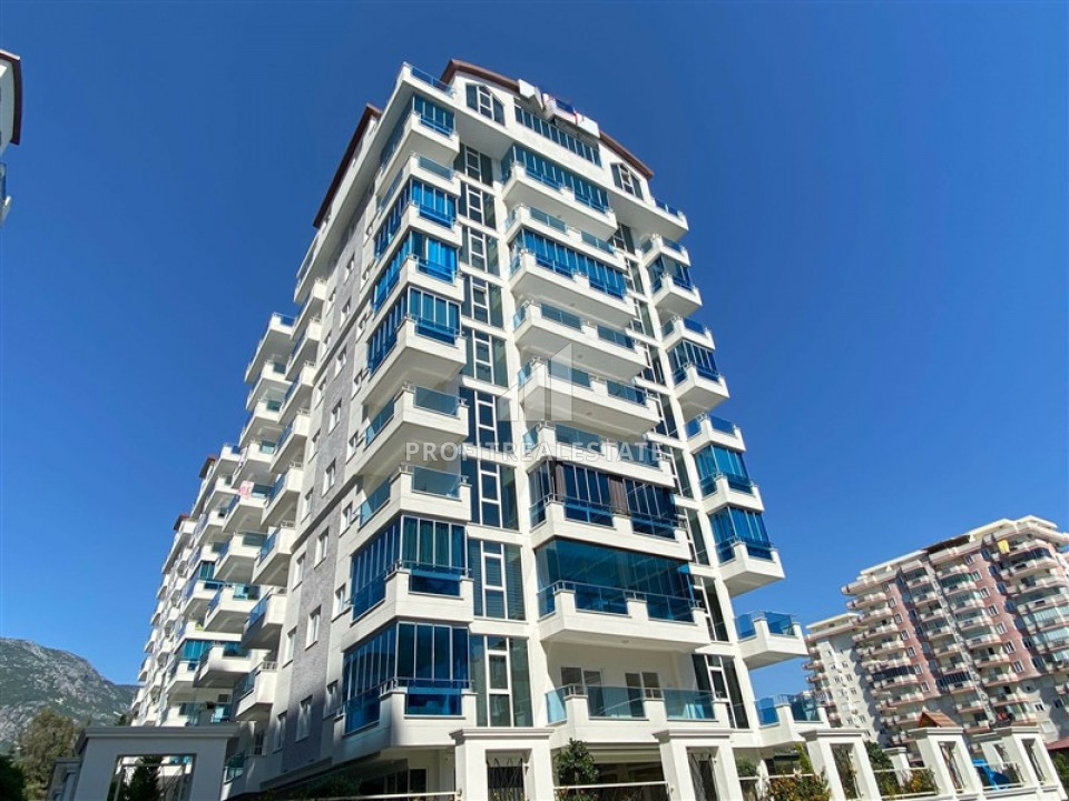 In an elite residence: 1 + 1 unfurnished apartment 400m from the beaches of Mahmutlar ID-6600 фото-1