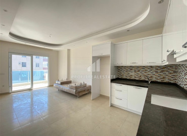 In an elite residence: 1 + 1 unfurnished apartment 400m from the beaches of Mahmutlar ID-6600 фото-3}}