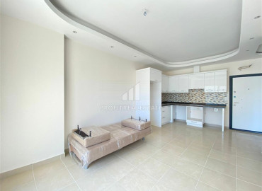 In an elite residence: 1 + 1 unfurnished apartment 400m from the beaches of Mahmutlar ID-6600 фото-4}}