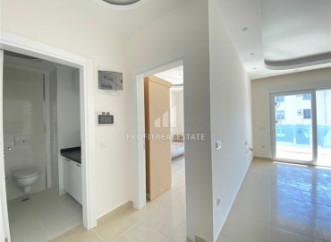 In an elite residence: 1 + 1 unfurnished apartment 400m from the beaches of Mahmutlar ID-6600 фото-12}}