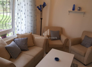 Cozy furnished two-bedroom apartment with access to the garden by the sea in the center of Alanya ID-6607 фото-1}}