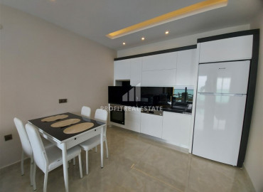 One-bedroom apartment in a premium residence on the first line in Mahmutlar. ID-6724 фото-30}}