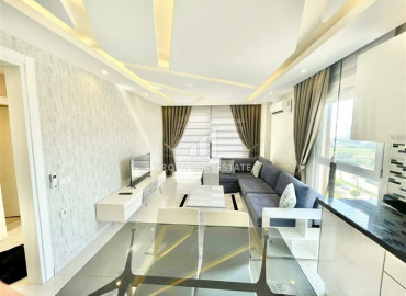 Обустроенная двухкомнатная квартира на высоком этаже, 65м² на центральной улице Махмутлара ID-6729 фото-2