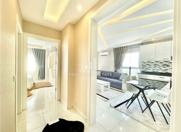 Furnished one-bedroom apartment on a high floor, 65m² in the central street of Mahmutlar ID-6729 фото-3