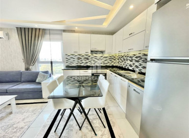 Furnished one-bedroom apartment on a high floor, 65m² in the central street of Mahmutlar ID-6729 фото-4