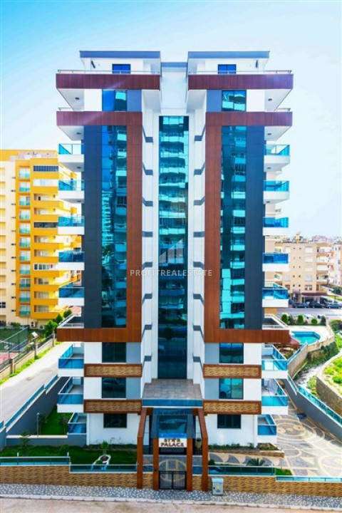 Large furnished 1 + 1 apartment in a residence with wide facilities in Mahmutlar ID-6825 фото-2
