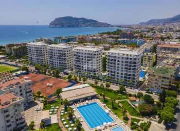 Luxurious one-bedroom apartment in an elite residence with hotel facilities, just 50 meters from the sea, Alanya, center ID-6974 фото-1