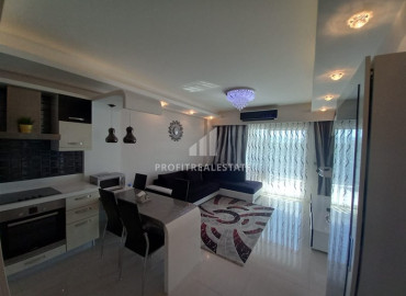 Furnished one-bedroom apartment in an elite residence at the foot of the Taurus Mountains in Mahmutlar ID-7037 фото-1