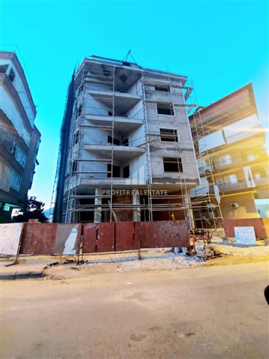 Квартиры в доме городского типа на этапе строительства в центре Алании по привлекательной цене ID-7130 фото-2