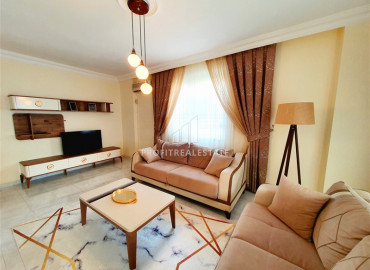Inexpensive resale property 300m from the sea: furnished two-bedroom apartment in Mahmutlar ID-7214 фото-1