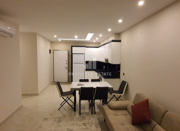 Two-bedroom apartment in a residence on the first line of the Konak Tower in Mahmutlar ID-7220 фото-2