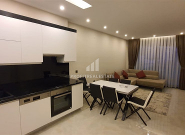 Two-bedroom apartment in a residence on the first line of the Konak Tower in Mahmutlar ID-7220 фото-5