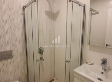 Two-bedroom apartment in a residence on the first line of the Konak Tower in Mahmutlar ID-7220 фото-14