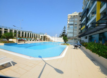 Two-bedroom apartment in a residence on the first line of the Konak Tower in Mahmutlar ID-7220 фото-33
