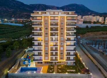 In a new residence in Mahmutlar - furnished 1 + 1 apartment with an area of 65m² ID-7234 фото-1