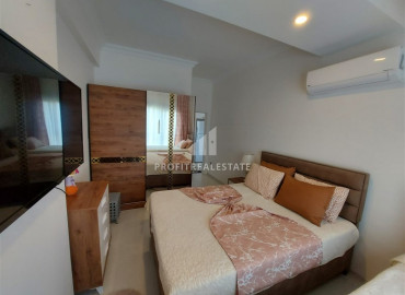 Двухкомнатные апартаменты с мебелью, в жилом комплексе 2020 года строительства, в центре Махмутлара, 55 м2 ID-7240 фото-12