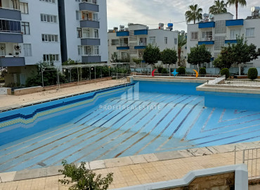 Three-bedroom apartment in a residence with a swimming pool in Davulttepe microdistrict, Mezitli, 700m from the sea ID-7654 фото-1