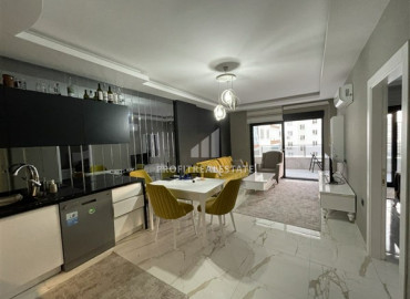 One-bedroom apartment with designer interior in a residence with a swimming pool in Mahmutlar ID-7680 фото-1