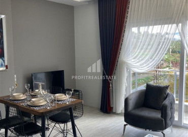 Furnished 1 + 1 apartment with mountain views in a residence with good facilities in Mahmutlar ID-7783 фото-5