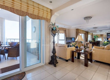 Spacious furnished duplex 2 + 1 with excellent views of the mountains and the sea on the main street of Mahmutlar ID-7906 фото-2