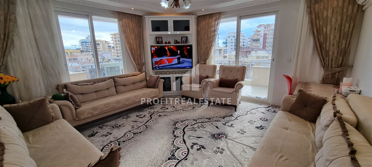 Large two bedroom apartment with a separate kitchen 300m from the sea in Mahmutlar ID-7944 фото-1
