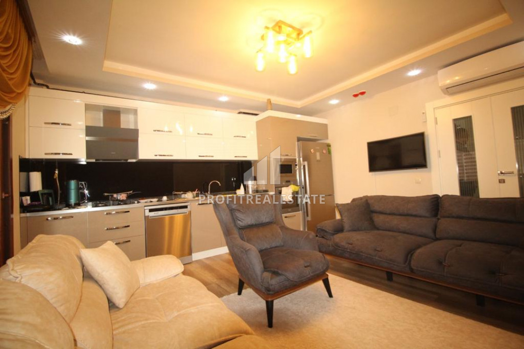 Spacious furnished two-bedroom apartment 450m from the sea in the area of Mersin - Tece ID-7945 фото-1