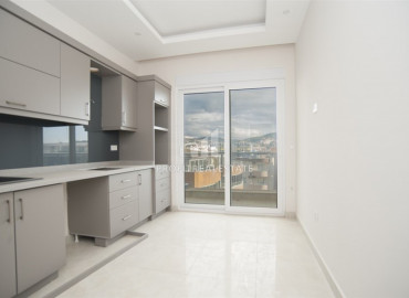New 2 + 1 apartment with a separate kitchen in a premium class residence in Mahmutlar ID-8052 фото-4