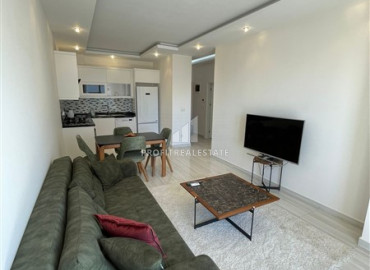 Furnished apartment 1 + 1, with an area of 65m² in a new residence in Mahmutlar ID-8144 фото-1
